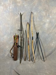 Antique Archery Set With Bows, Quiver, And Arrows