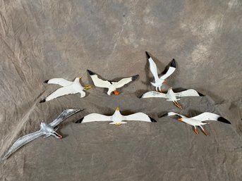 Collection Of Seven Vintage Seagull Figurines, Showcasing Various Flight Poses And Painted In White And Silver