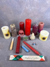 Collection Of Various Candles Ranging In Sizes And Use