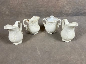 White Porcelain Pitcher And Sugar Bowl Set With Embossed Floral Design