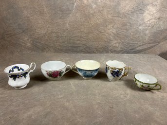 Group Of Five Painted Teacups, Varying In Designs And Origins
