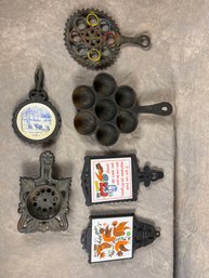 Collection Of Vintage Cast Iron And Ceramic Trivets